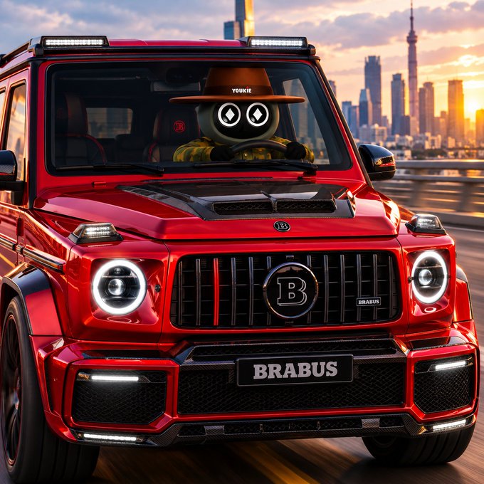 A red Brabus SUV with a character wearing a 'YOUKIE' hat driving, set against a sunset city skyline.