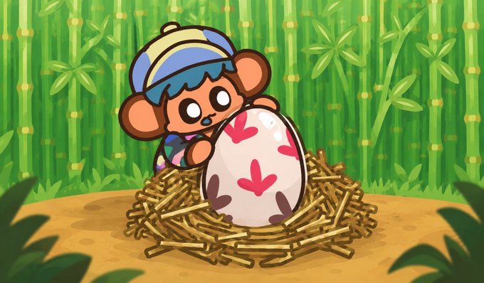 A cartoon illustration of a monkey character wearing a blue and yellow striped hat, holding a large speckled egg while sitting in a straw nest against a bamboo background.
