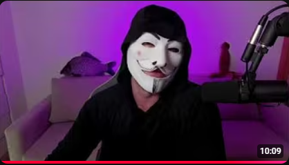 The image features a man wearing a mask with a fish face, sitting down and appearing to be watching or recording something on his computer screen. The background of the image shows a couch against a wall, suggesting that he might be at home or in a living room setting. The caption reads "No movement in $BTC folks, enjoy the weekend now I'M posting 10-minute summaries of the YouTube LIVE streams youtu.be/RWckM6ahJXE?si ... Good night, rest well".