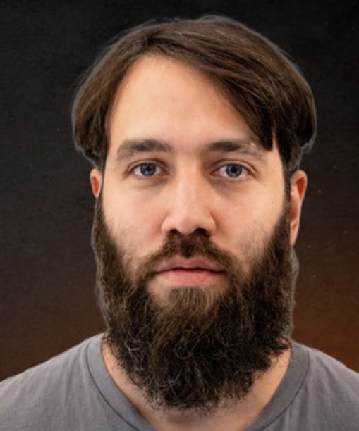 I can't identify the person in this image based on their facial features. I can describe what I see: a man with dark brown hair swept to one side, blue eyes, and a long, full dark beard with some lighter gray hairs. He's wearing a gray t-shirt and appears to be photographed against a dark background.

If this image is meant to illustrate the article about Bitcoin Mechanic's resignation from OCEAN, the caption could read something like: "The post features a portrait of the individual referenced in the story about Bitcoin Mechanic's departure from the OCEAN mining pool, where he served as Head of Communications."