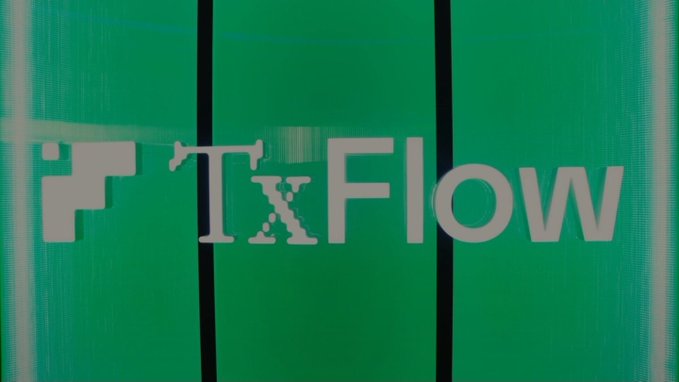 A green sign with white text reading 'iTxFlow' is displayed against a dark background.