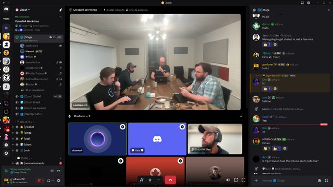 A screenshot of a Discord voice channel called 'Crusnik Workshop' in the 'Zcash' server showing multiple participants, with the main video feed displaying four men sitting around a table with laptops in a room, and a chat sidebar on the right.
