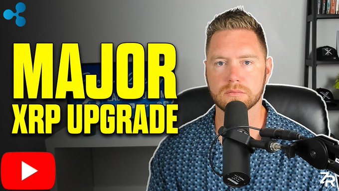 A thumbnail for a YouTube video featuring a bearded man in a blue shirt speaking into a microphone, with bold yellow text overlay reading "MAJOR XRP UPGRADE" alongside the XRP/Ripple logo, promoting content about significant developments for the XRP cryptocurrency ahead of a potential bull run.