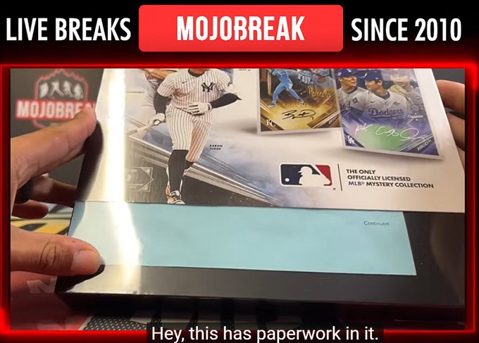 A person holds open a Topps MLB Mystery Collection box, displaying Aaron Judge and Dodgers autograph card images, with a caption noting "Hey, this has paperwork in it." The image supports the post's concern that trading card boxes are being curated at the packaging level before reaching breakers, potentially undermining the randomness of breaks.