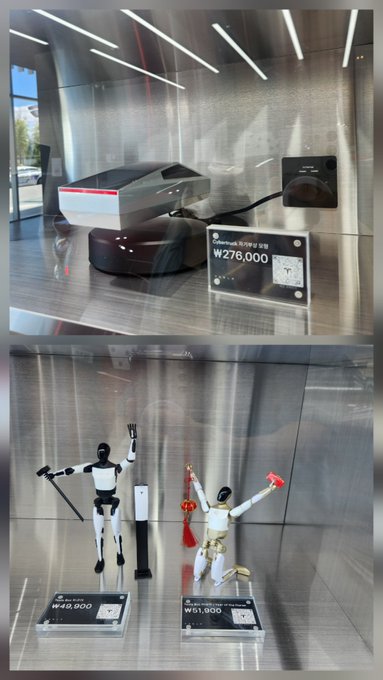 Two photos showing expensive sci-fi collectibles on display: a Powerbeats charging case priced at ₩276,000 on top, and robotic figurines priced at ₩45,900 and ₩51,900 below.