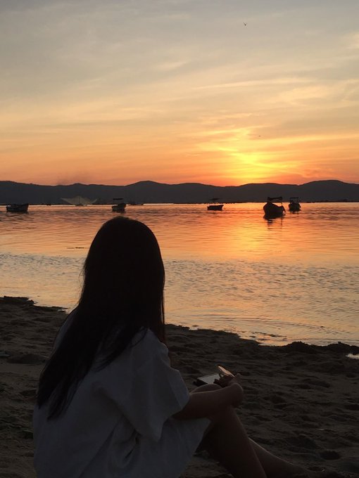 A silhouetted figure sits on a beach at sunset, gazing out at small boats on the calm water as warm orange light reflects across the bay.

The image pairs with the post by offering a contemplative, serene moment—mirroring the thoughtful tone of reflecting on @quipnetwork's infrastructure approach, where quiet depth (like the stillness of the water at dusk) supports meaningful connections rather than dramatic spectacle.