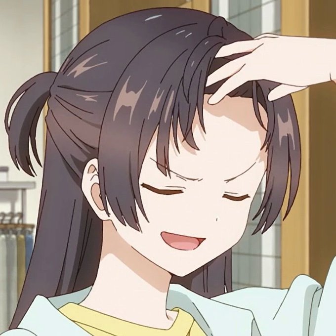 An anime-style image of a young woman with long dark hair tied in a ponytail, eyes closed and smiling gently as someone's hand rests on her head.