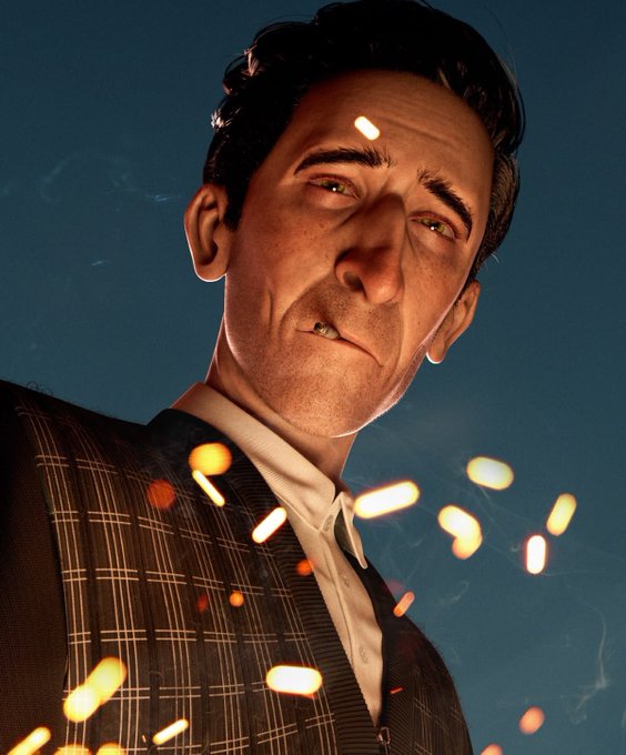 A dramatic low-angle portrait of a man in a plaid suit and white shirt, with sparks or embers floating around him against a dark blue background.