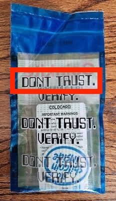 A sealed blue Coinkite package displays repeated "DON'T TRUST. VERIFY." warnings printed over the enclosed items, with a red box highlighting the topmost phrase—emphasizing the brand's transparency messaging referenced in the accompanying post.