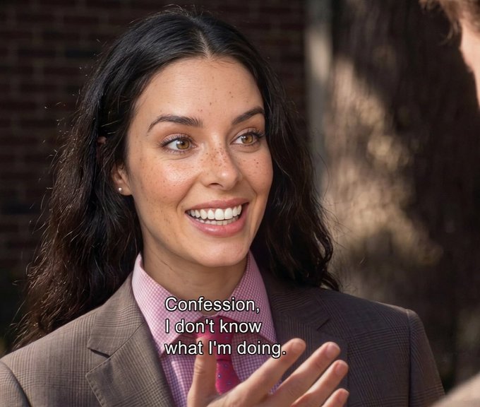 The image features a woman wearing a suit, smiling brightly as she talks with someone else. There are two lines of text in the image that read "Confession, I don't know what I'm doing" and "Focus on what is in the image and how it relates to the post". The woman's smile suggests that she might be discussing something positive or humorous related to Bitcoin, as suggested by Michael Saylor's comment about adding dots.