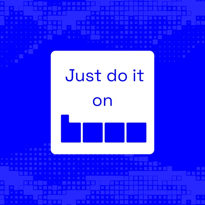 The image features a square sign with the words "Just do it" written on it against a blue background, which appears to be a pattern of small squares or blocks. The text is white, making it stand out against the blue backdrop. The caption below the image reads "Good Morning Base isn' t just another chain. It' s becoming a home for creators, developers, @base and communities looking to build the future onchain". This message seems to be related to the concept of Base in 2026 or Baseapp, which is an app development platform that allows users to create, manage, and share their own apps. The image conveys a sense of motivation and encouragement for people to embrace new ideas and technologies like Baseapp.