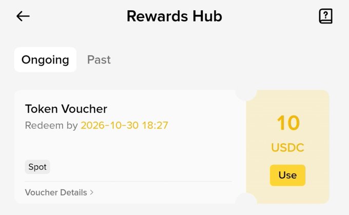 A 'Rewards Hub' interface screen displaying a 'Token Voucher' for 10 USDC with a redemption deadline of 2026-10-30.