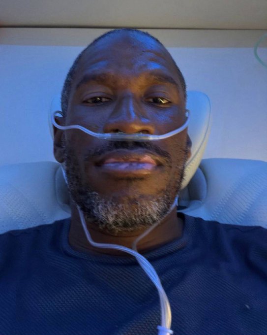 A man lies in a hospital bed with a nasal cannula, appearing sedated or in critical condition. The image humorously illustrates the "POV of $HYPE sellers" by depicting someone visibly suffering—a visual metaphor for the pain of those who sold the trending ticker too early.