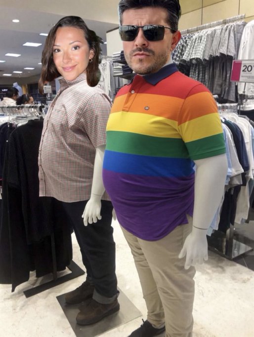 Two mannequins in a clothing store: one displaying a head of a woman with short hair and a checkered shirt, and another displaying a man's head with sunglasses on a rainbow-striped polo shirt.