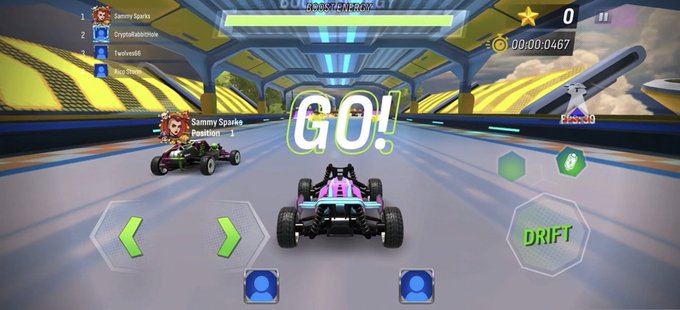 A screenshot from a mobile racing game showing a 'GO!' countdown with player 'Sammy Sparks' leading on the leaderboard, featuring a kart race with 'COLOSSEUM CIRCUIT' visible at the top.
