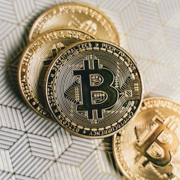 The image features a collection of gold Bitcoins stacked together on top of each other. The Bitcoins are arranged in a way that they appear to be floating or levitating, giving them an airy and futuristic appearance. The text "LATEST: Bitcoin topped on day 1,162 of the current cycle" suggests that this is a recent image capturing the peak moment when Bitcoin was first introduced into the market. The post also mentions that Bitcoin is likely to bottom in October 2026, which could be interpreted as an indication of its potential decline or a milestone in its history.