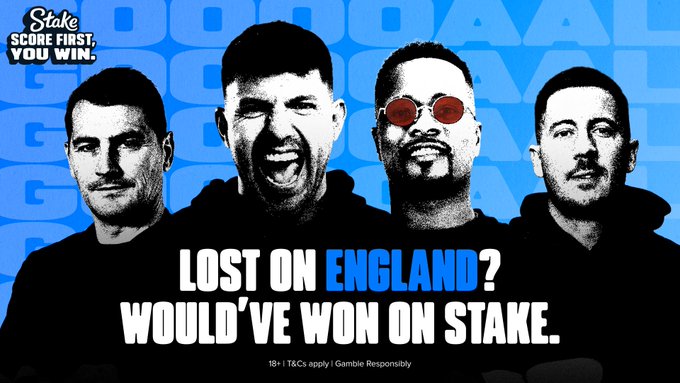 A Stake promotional graphic features silhouettes of four footballers against a blue patterned background, with the headline "LOST ON ENGLAND? WOULD'VE WON ON STAKE." alongside the "Score First, You Win" campaign tagline. The ad ties to England's match where scoring first wasn't enough to win, promoting Stake's offer to pay out customers who lost similar bets on other sportsbooks.