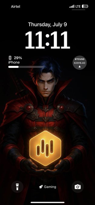 iPhone lock screen dated Thursday, July 9 at 11:11 showing 29% battery, BTCUSD 62916.40, featuring a Marvel-style character wallpaper with a 'Gaming' app shortcut.