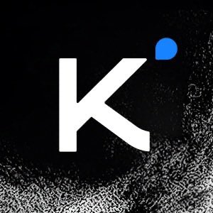 A minimalist black-and-white logo featuring a large white letter 'K' with a small blue accent shape (resembling a water drop or speech bubble) in the upper right corner, with a grainy distressed texture.