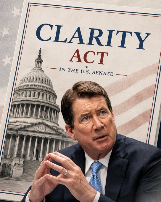A news graphic promoting the "CLARITY ACT — IN THE U.S. SENATE" features a photo of Sen. Bill Hagerty speaking, set against a backdrop of the U.S. Capitol and an American flag. The image visually reinforces the post's message about Hagerty's push for the Crypto Clarity Act to keep the U.S. competitive in global crypto adoption.