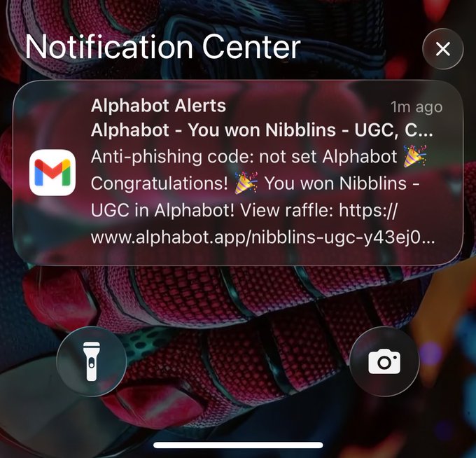 A smartphone notification center displays an Alphabot Alerts message claiming the user won Nibblins - UGC, with a suspicious link to alphabot.app/nibblins-ugc-y43ej0 and noting the anti-phishing code is not set.