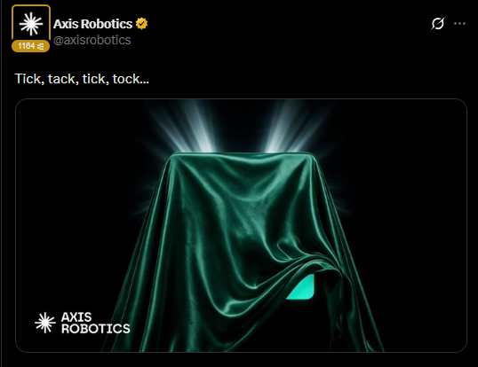 A tweet from Axis Robotics (@axisrobotics) reads "Tick, tack, tick, tock..." above an image of a mysterious object draped in a dark green cloth illuminated from beneath.