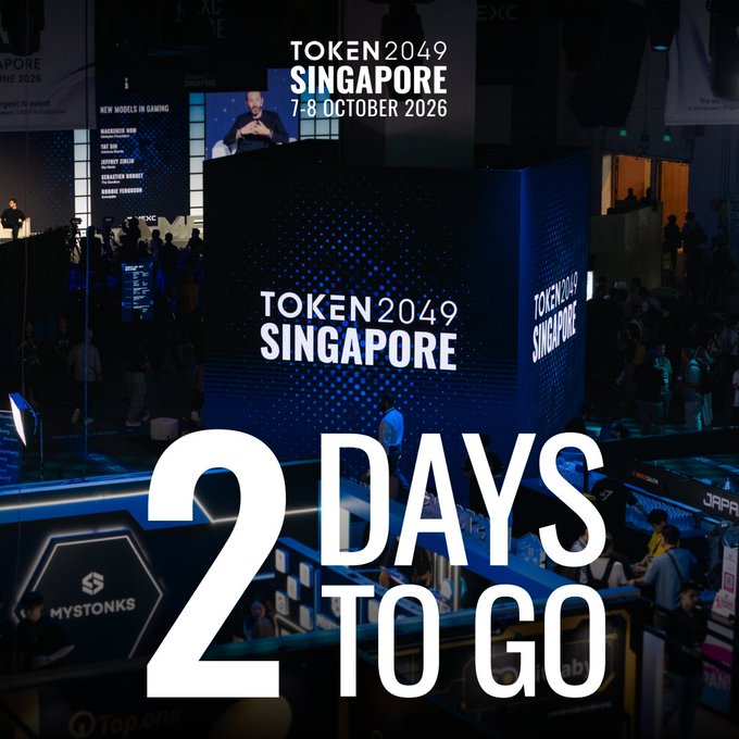 A promotional poster for TOKEN2049 Singapore, taking place on 7-8 October 2026, featuring a dark conference stage background with large text reading '2 DAYS TO GO'.