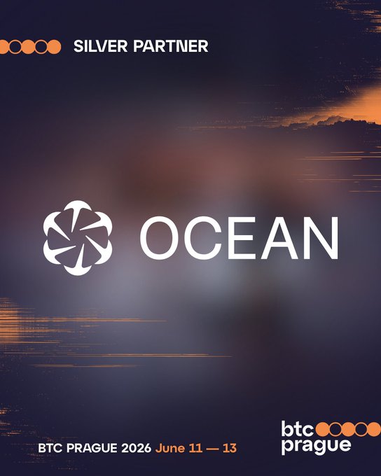 The image features an advertisement for Bitcoin mining company OCEAN. The poster has a blue background with white text that reads "OCEAN" at the top. Below this, there are two orange circles containing the words "BTC" and "PRague". These circles also contain the dates "2026 June 11 - 13" and "DATUM", which may be related to Bitcoin mining events or conferences. The poster aims to promote transparency in the mining process by highlighting OCEAN's focus on non-custodial bitcoin mining, as well as providing information about upcoming events.