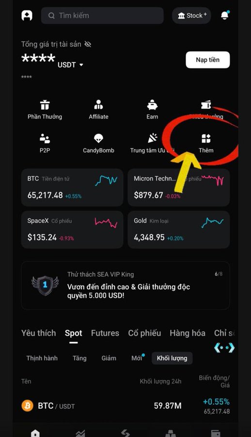 The image shows a Bitget app interface with the "Thêm" (More) option circled in red, highlighting where users can access additional features including the Stock section showing market data for BTC ($65,217.48), SpaceX ($135.24), Micron Technology ($879.67), and Gold ($4,348.95). This relates to the post about Bitget's ACE token reward-sharing program, as users would likely navigate through the app to find and participate in the ACE locking promotion mentioned.