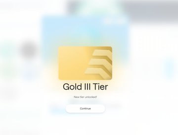 A digital achievement notification showing 'Gold III Tier' unlocked with a Continue button.