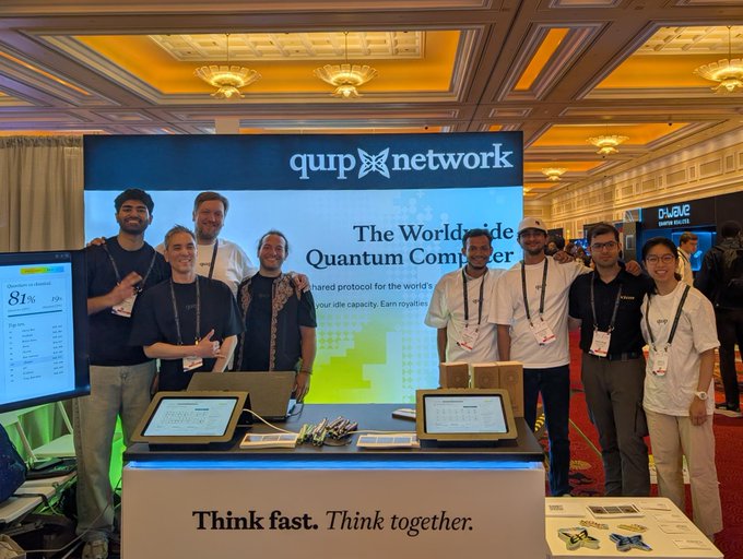The Quip Network team poses together at their booth in front of a display reading "The Worldwide Quantum Computer," with the tagline "Think fast. Think together." visible on the front of their table.

The image aligns with the post by showcasing the Quip Network team at what appears to be an industry conference, highlighting the people behind their project focused on quantum computing and the decentralized idle capacity protocol discussed in the caption.