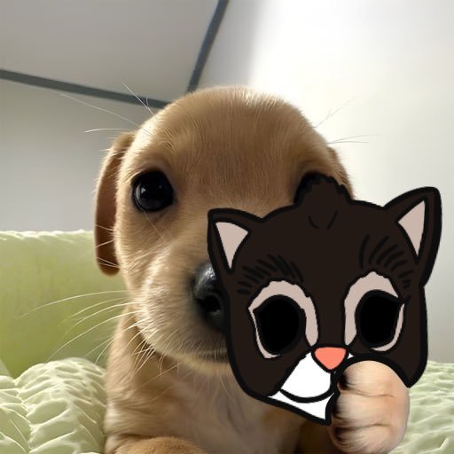 A golden retriever puppy holds up a black and white cartoon cat mask in front of its face while lying on a light green surface.