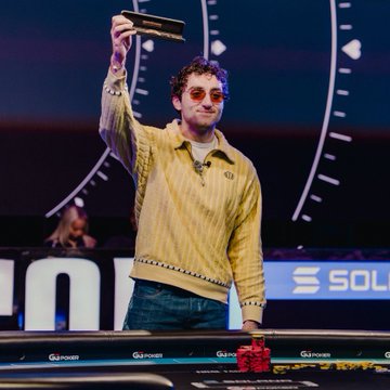 A man wearing red sunglasses and a yellow sweater triumphantly holds up a championship belt above his head, with "G POKER" and "SOL" branding visible in the background, as the caption celebrates his remarkable trading success including a 5k to 100k run and triple-digit gains in $GME, $pons, and $marscoin.