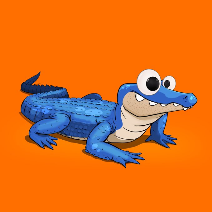 A cartoon illustration of a blue crocodile with large googly eyes and a smiling mouth, posed on an orange background.
