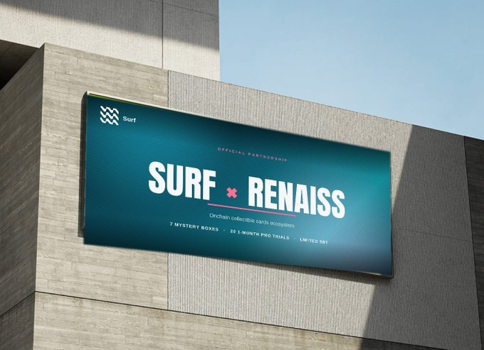 A large billboard on a concrete wall advertising an 'OFFICIAL PARTNERSHIP' between 'SURF x RENAISS', describing it as an 'Onchain collective cards ecosystem' with '7 MYSTERY BOXES', '2X 1-MONTH PRO TRIALS', and 'LIMITED SBT'.