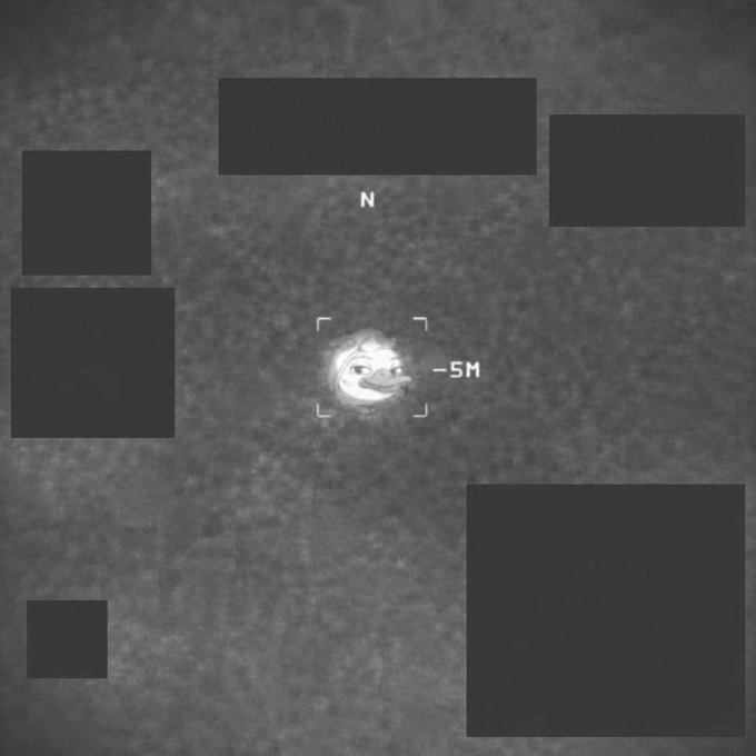 The image shows a black and white photo of a square with a face drawn on it, which appears to be a person's face or an animal. The square has the numbers "N" and "SH" written on it. The background is a dark gray color, providing contrast for the figure in the center. The text "current local time is 02/06/2021 00:04 GMT+7 so its time to check wallchain for new clusters today i noticed one reply chain from days ago just surfaced a solid partner pull without any manual nudge this sustained context routing feels like the real edge over pure daily hits".