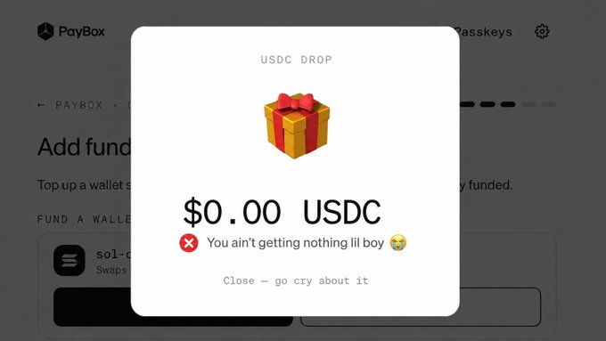 A screenshot of a PayBox "USDC DROP" notification showing a $0.00 USDC allocation, accompanied by a red X icon and the humorous message "You ain't getting nothing lil boy 😭" with a "Close — go cry about it" option, illustrating the joke about receiving no airdrop allocation from MoonPay's PayBox event.