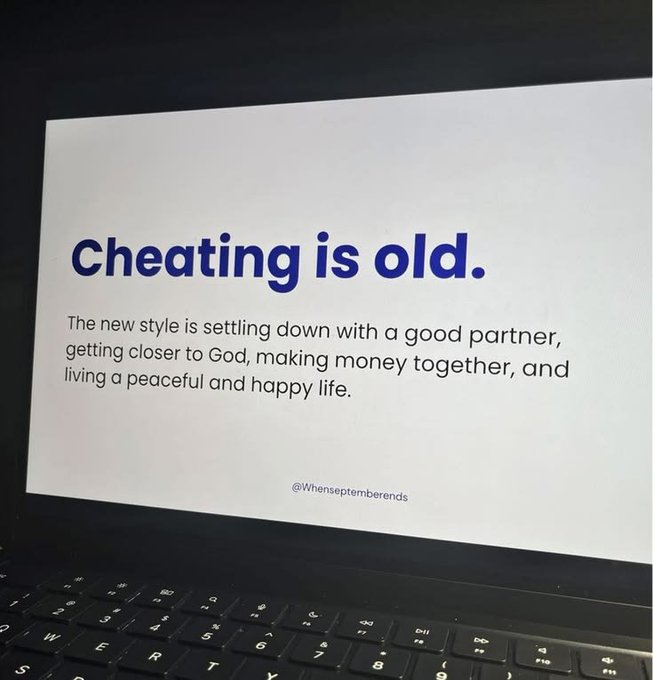 A laptop screen displays an image with the bold blue text "Cheating is old." followed by smaller text reading "The new style is settling down with a good partner, getting closer to God, making money together, and living a peaceful and happy life," attributed to "@Whenseptemberends."