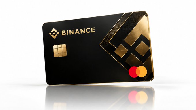 A black and gold Binance-branded credit/debit card featuring the Binance logo, a gold EMV chip, and Mastercard logos in the bottom right corner.
