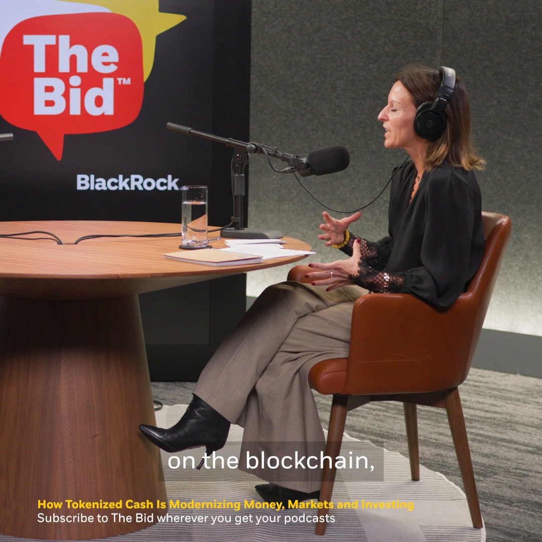 A woman wearing headphones speaks into a studio microphone during a recording of "The Bid" podcast, sponsored by BlackRock. Visible text includes "on the blockchain," and "How Tokenized Cash Is Modernizing Money, Markets and Investing – Subscribe to The Bid wherever you get your podcasts." The image relates to the post by depicting Beccy Milchem, BlackRock's Global Head of Cash Distribution, in the podcast recording session where she discusses tokenization's potential for faster, 24/7 money movement.