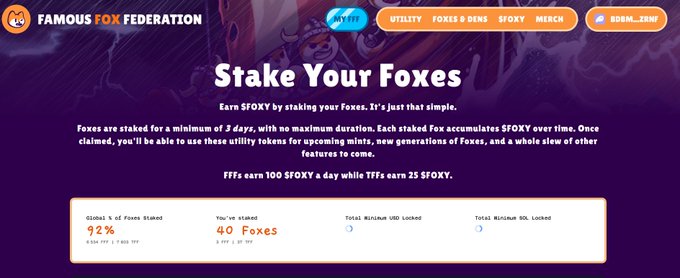 A screenshot of the Famous Fox Federation website promoting a 'Stake Your Foxes' program to earn $FOXY utility tokens, showing 92% of foxes staked.