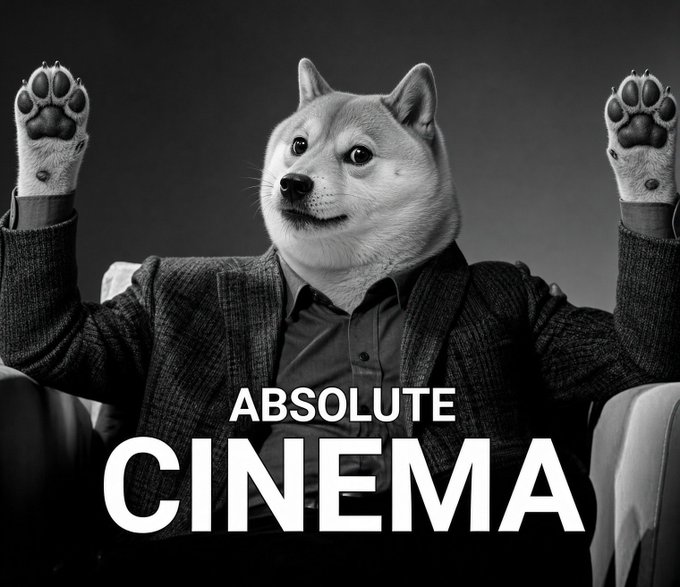 A humorous black-and-white edit featuring a Shiba Inu dog's head on a human body in a suit, sitting in a chair with its arms raised in excitement, overlaid with the text 'ABSOLUTE CINEMA'.