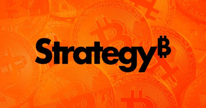 An orange graphic with the word 'Strategy' in black, where the final 'B' is replaced by a Bitcoin '₿' symbol, set over a background of Bitcoin coins.