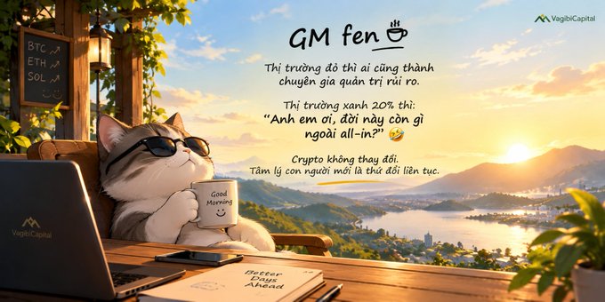 An illustration shows a contented cat wearing sunglasses holding a "Good Morning" mug beside a laptop, with a chalkboard displaying "BTC ↗, ETH ↗, SOL ↗" against a scenic sunrise landscape. The Vietnamese "GM fen" caption playfully contrasts how investors become risk-management experts during red markets but rush to "all-in" during 20% green runs, humorously noting that crypto stays the same while human psychology constantly shifts.