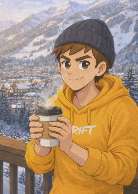 A young man in a yellow "RIFT" hoodie and gray beanie holds a steaming cup of coffee while overlooking a snowy mountain village. The cozy morning scene pairs perfectly with the "Good morning" message, capturing the warmth of a hot drink against a crisp winter backdrop.
