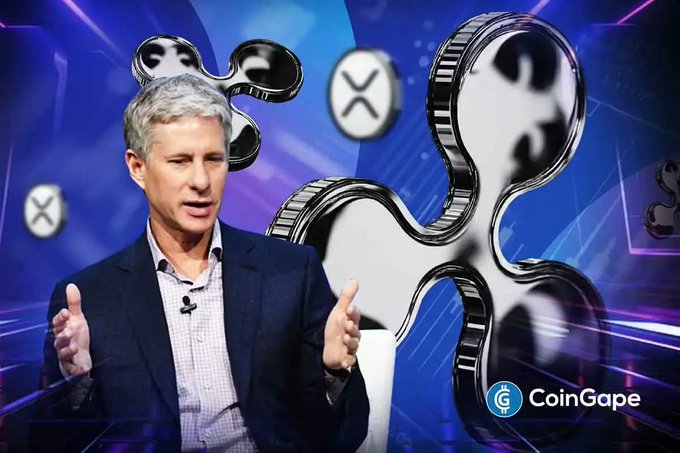 The image features Chris Larsen, Ripple's Executive Chairman, speaking with animated hand gestures against a blue digital backdrop displaying Ripple's (XRP) logo, accompanied by the "CoinGape" watermark in the corner.