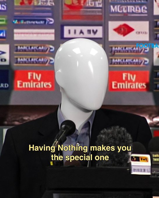 A faceless white mannequin wearing a black suit and blue shirt stands at a press conference podium, with sponsor logos including "Fly Emirates" and "METRO" visible in the background. Yellow text overlay reads: "Having Nothing makes you the special one"