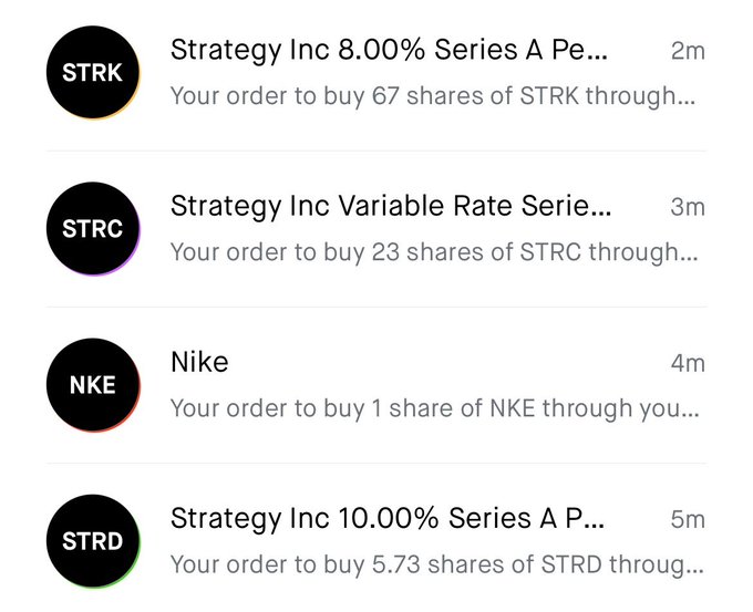 A screenshot of a mobile trading app showing pending buy orders for STRK (67 shares), STRC (23 shares), NKE (1 share), and STRD (5.73 shares) of Strategy Inc and Nike.