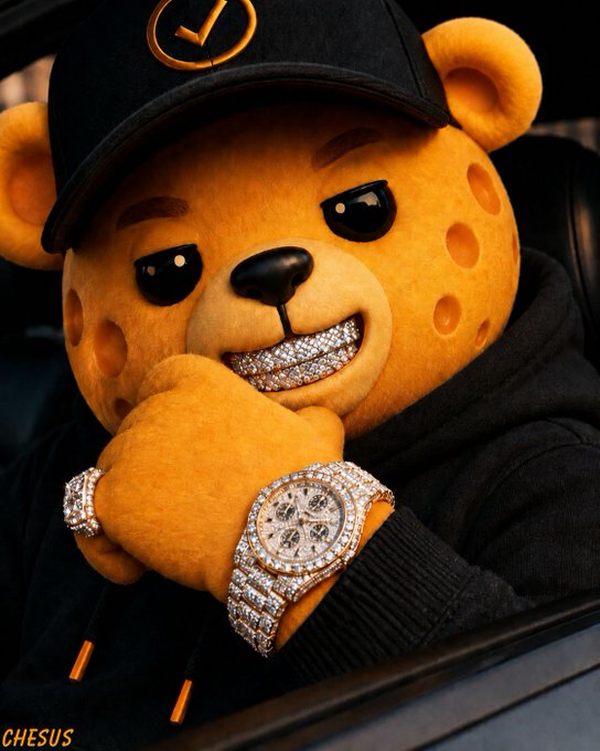A stylized AI-generated image of an anthropomorphic bear character wearing a cap and hooded jacket, displaying diamond-encrusted grillz and a luxury watch, with the watermark "CHESUS" in the corner.
