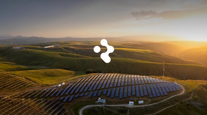 An aerial sunset view of a solar panel farm set in rolling green hills, with the white Hive blockchain logo overlaid in the center.